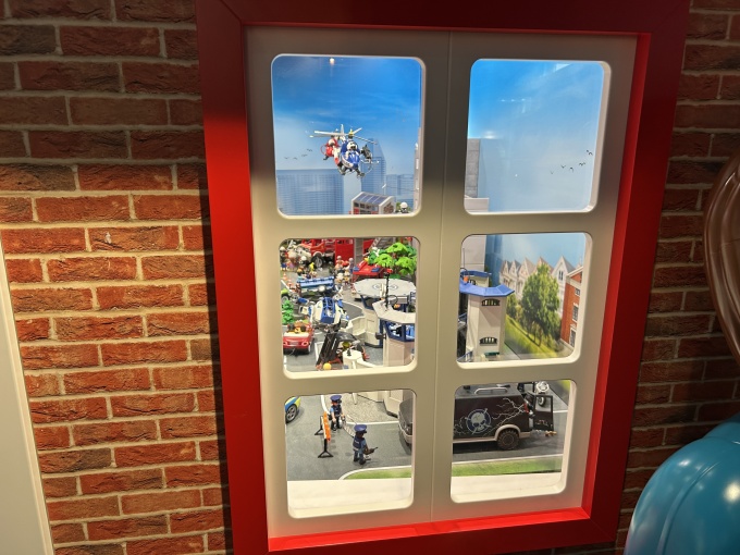 A window in the themed houses, through which visitors can view detailed city...