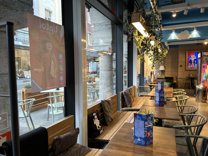 In the middle of the store is the “dolls kitchen,” a café where adults can...