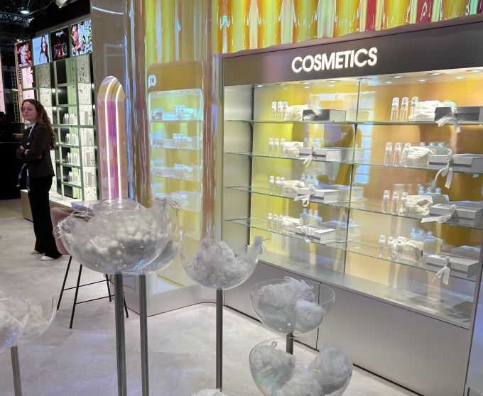 A white, simple curtain with bold yellow accents on the wall....