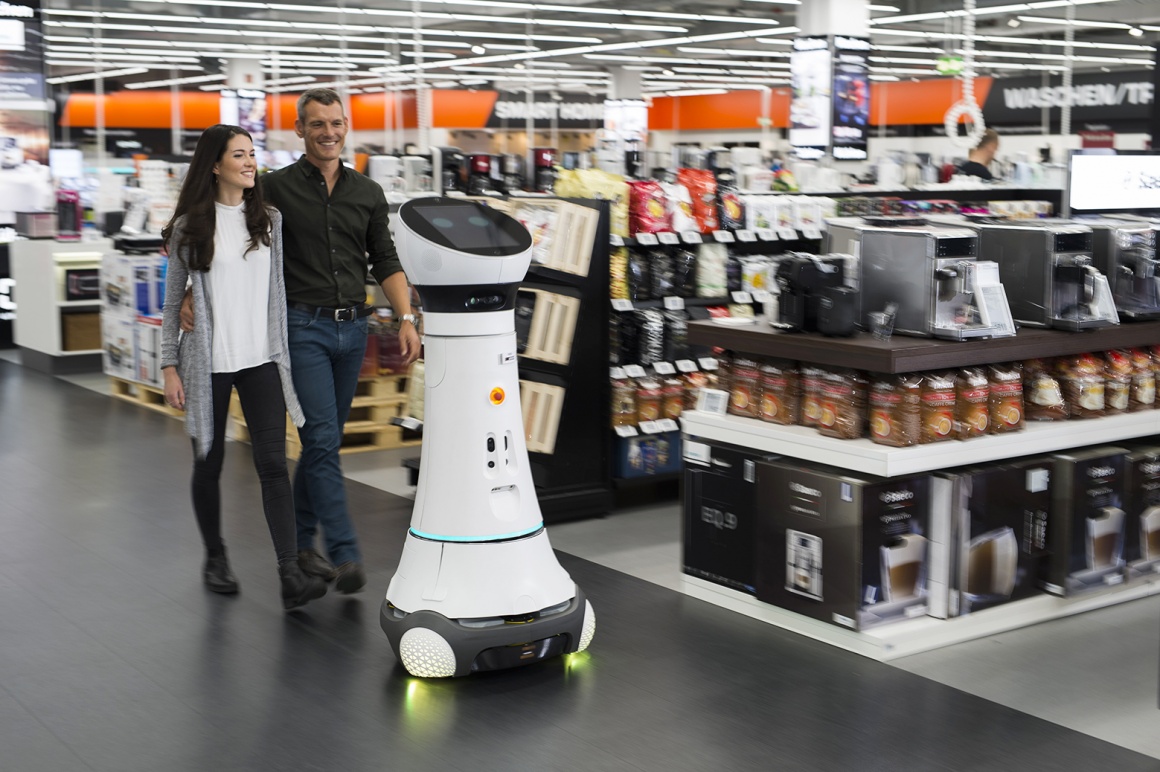 Paul, a member of the Care-O-bot 4 robot family, has been greeting customers in...