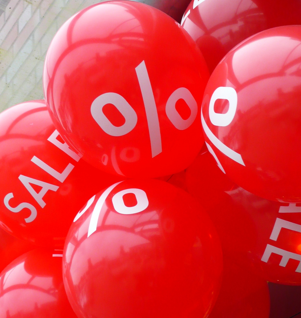 red balloons with sales promotion text