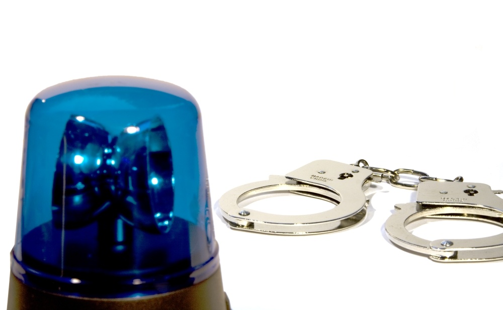 Handcuffs and police light