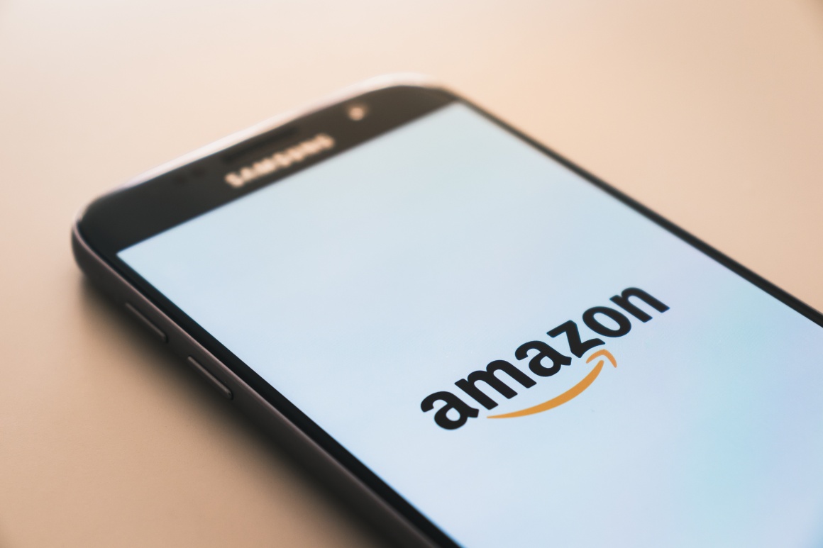 Smartphone with Amazon logo on screen