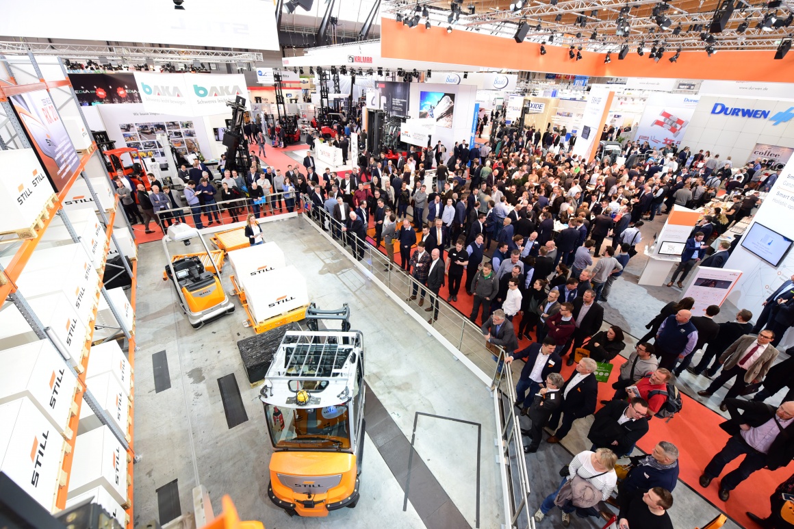 LogiMAT 2019 with visitors and one exhibitor with commercial vehicles;...