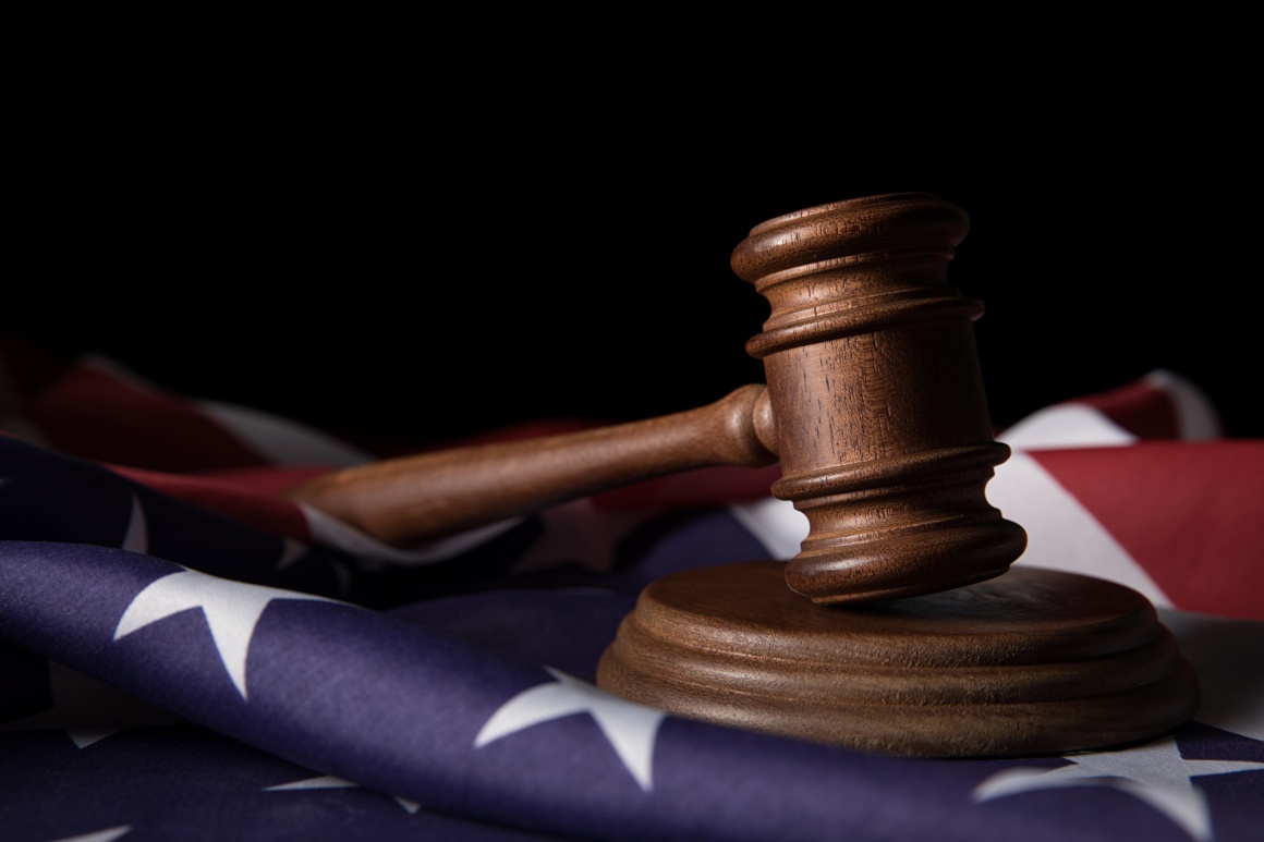 Judge’s gavel on an American flag; copyright: panthermedia.net/MicEnin...