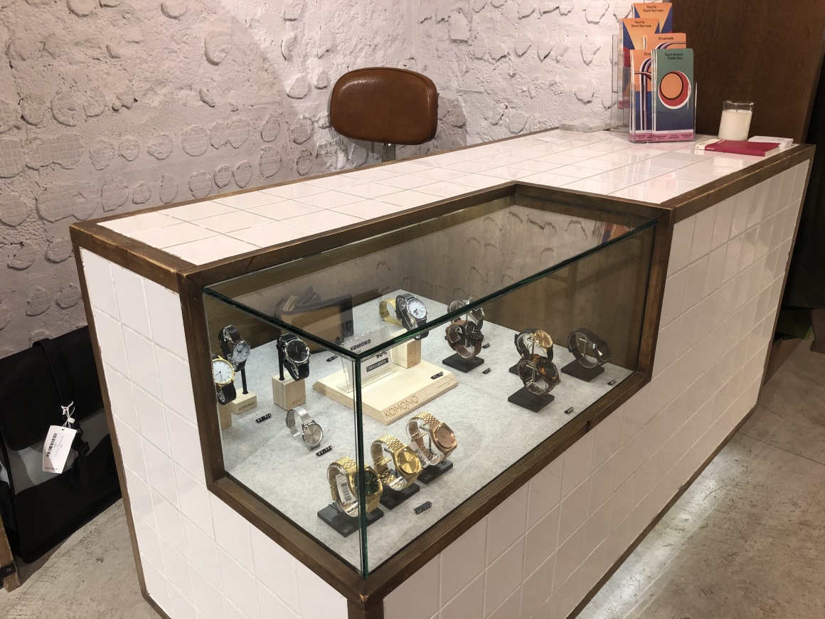 Checkout counter made of tiles with a built in glass case...