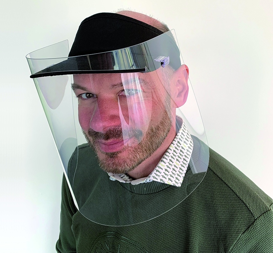 Managing director Oliver Voßhenrich wears a protective visor from the own...
