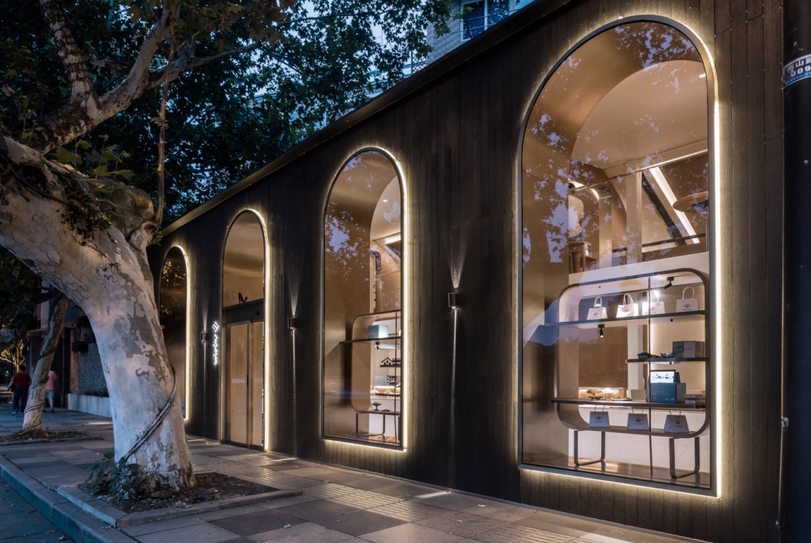 A modern style pastry store with curved arches and large windows...