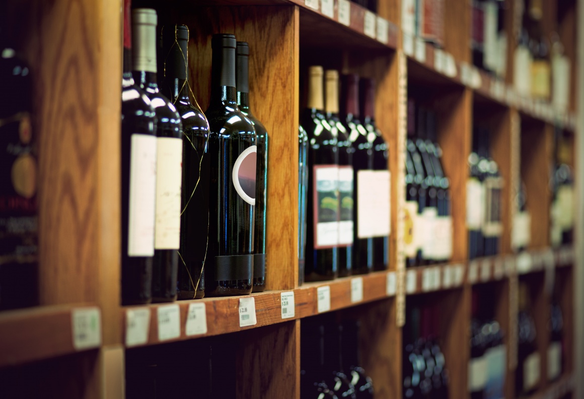 A wine rack with wine bottles