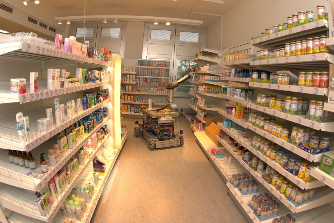 Robot driving through a drugstore.