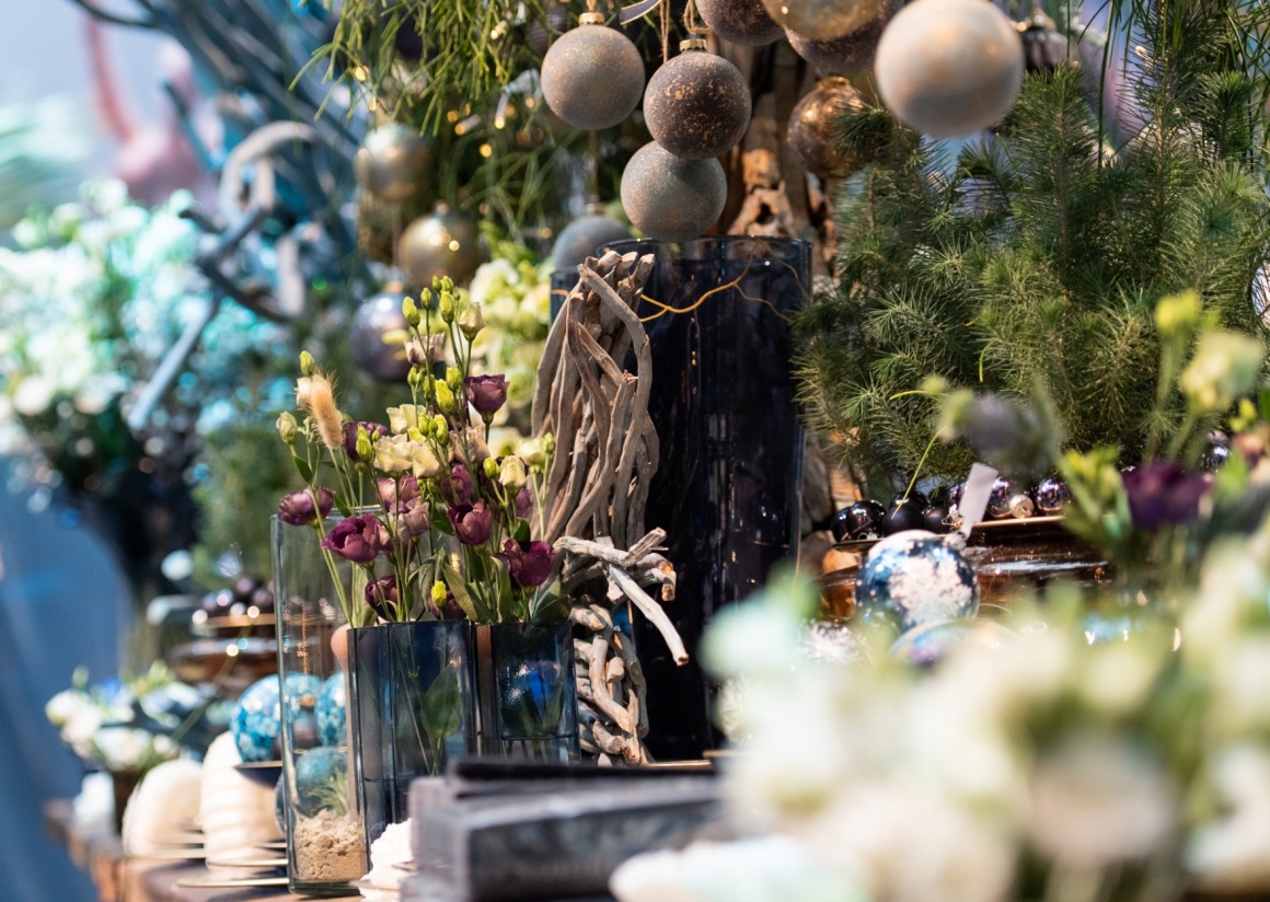 Christmas decoration with Christmas tree ball and plants in dark blue and green...