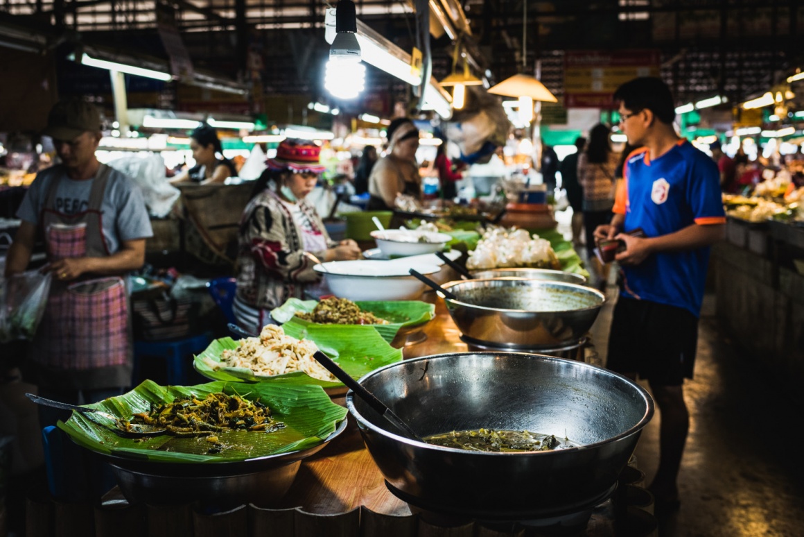 South Asian market with fresh prepared meals on a table...