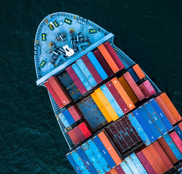 Birds view of a big container ship with many colorful containers...