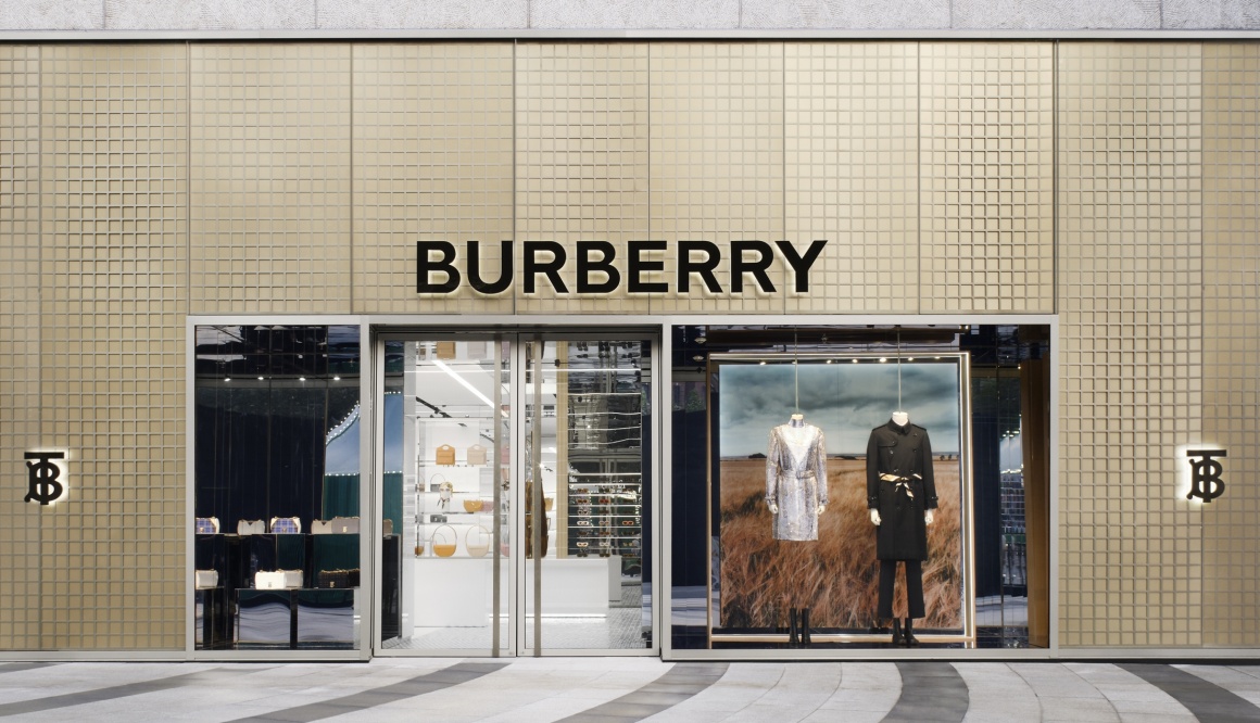 Luxury products on display in glass cabinets outside Louis Vuitton